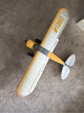 Remote - control airplane for novice to advanced flyers bright yewllow and white